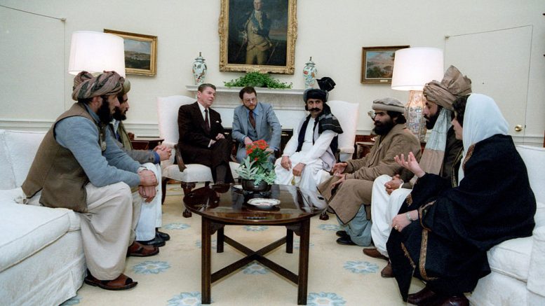 Reagan_sitting_with_people_from_the_Afghanistan-Pakistan_region_in_February_1983